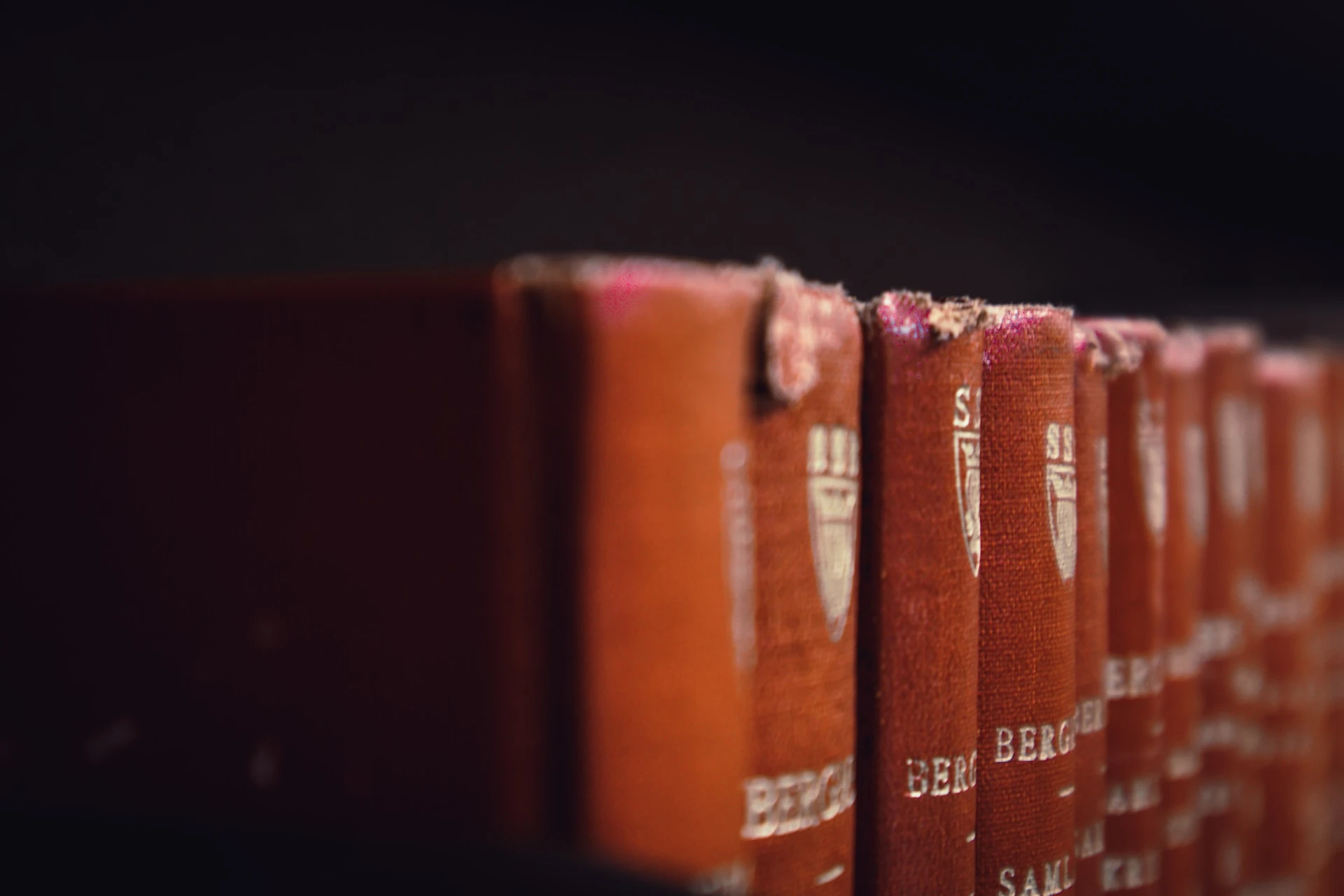 Legal books showing signs of shelf wear on the top of the bounded spines.